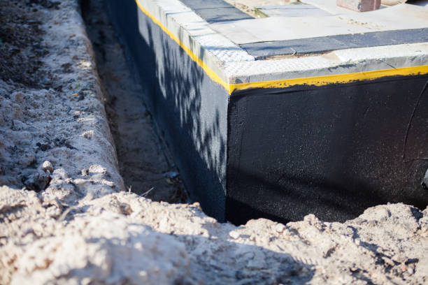 Professional Waterproofing technician working in Smithtown, NY